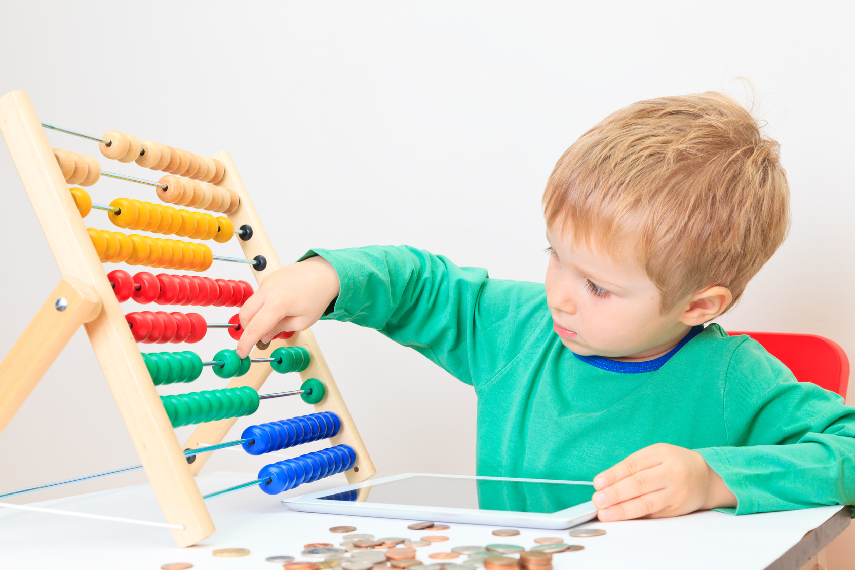 Little boy counting his savings